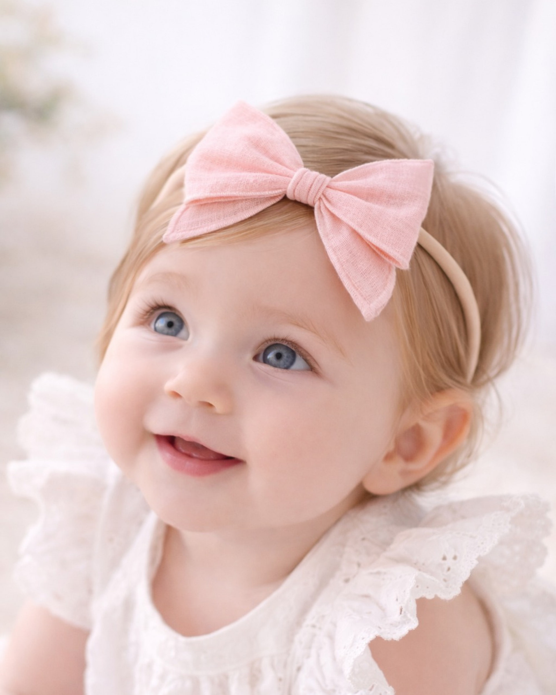 meow bowtique baby pink blush bow Baby girl wearing a blush pink linen bow headband, soft handmade bow hair accessory