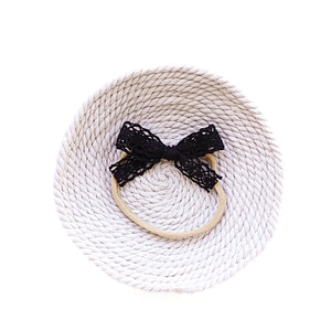 Black lace bow headband for baby girl on soft nylon band, minimalist style